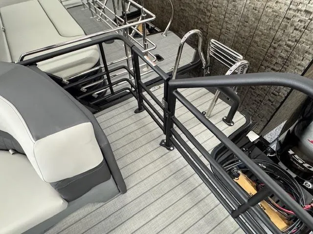 Slide: The Image of 2025 Starcraft SLS 1 boat interior with seating and safety railing. - 20