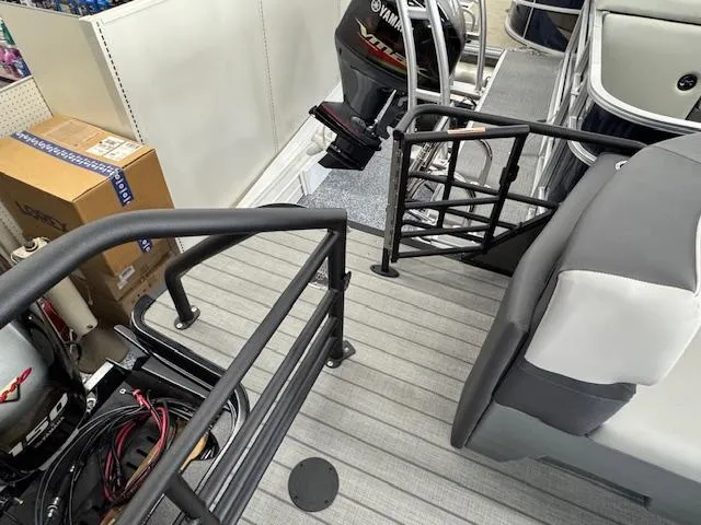 Slide: The Image of 2025 Starcraft SLS 1 boat interior with Yamaha outboard motor, gray seating, and railing. - 21
