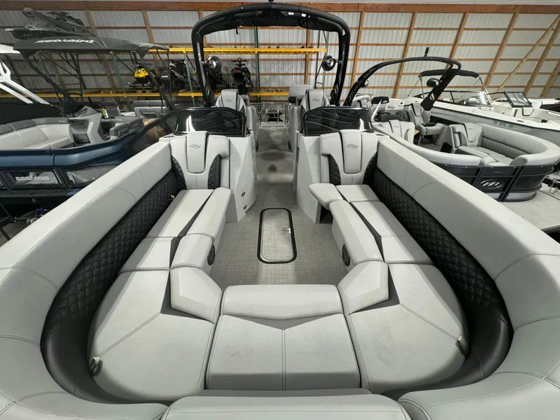 Slide: The Image of 2025 Manitou LX pontoon boat interior with spacious seating and modern design. - 1