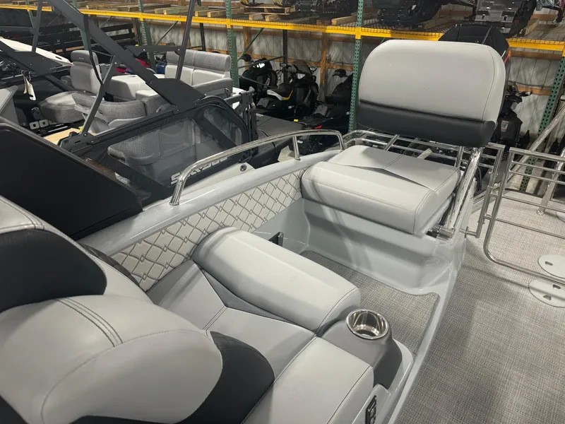 Slide: The Image of 2025 Manitou LX boat interior with luxurious seating and modern design. - 13