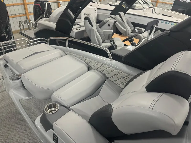 Slide: The Image of 2025 Manitou LX boat interior with luxurious seating and modern design. - 15