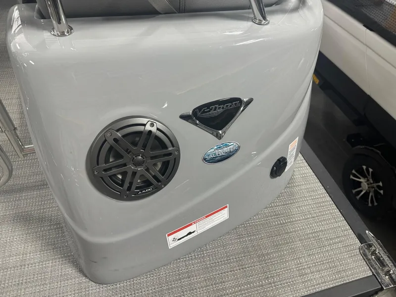 Slide: The Image of 2025 Manitou LX boat interior with speaker and logo details. - 19