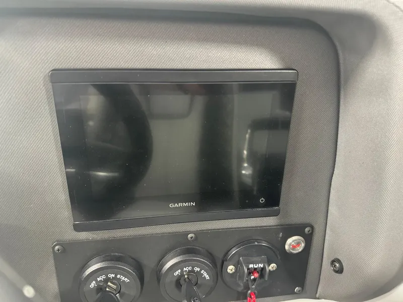 Slide: The Image of Dashboard of 2025 Manitou LX with Garmin display and control switches. - 7