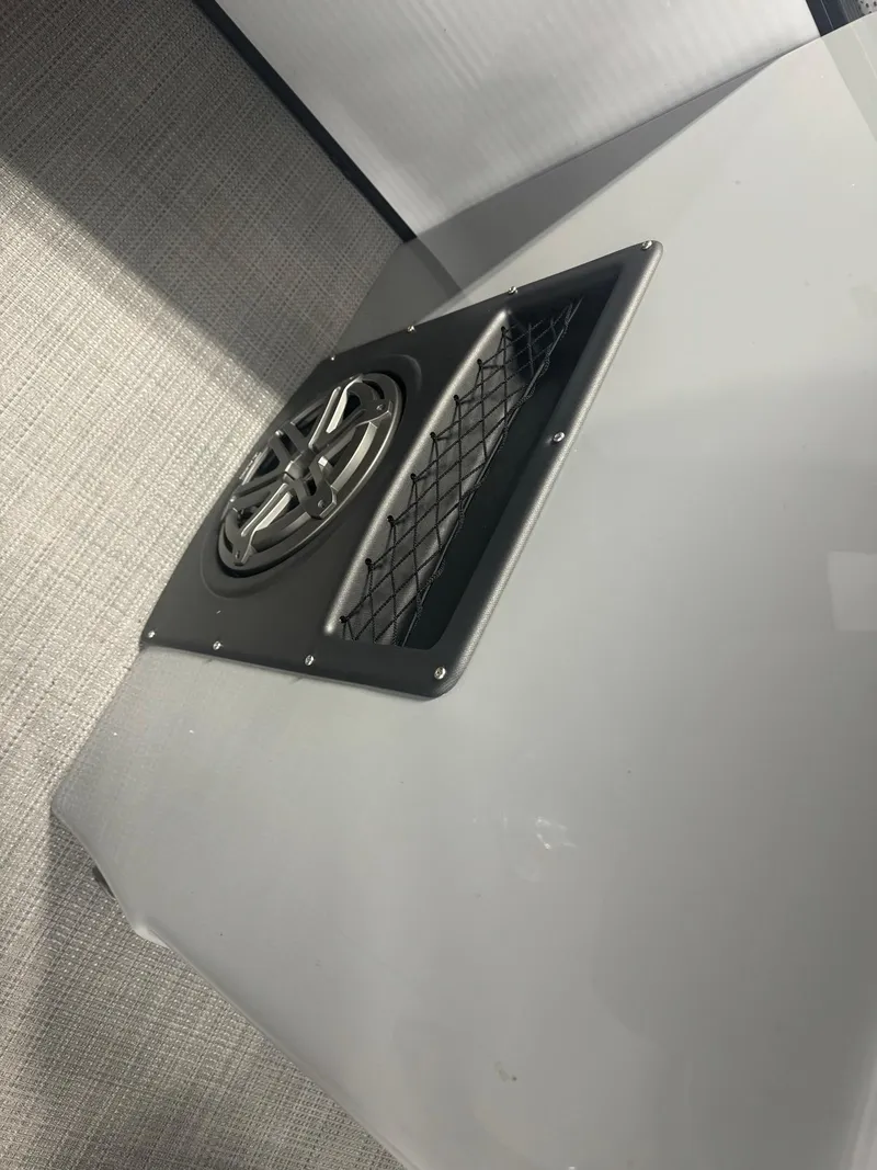 Slide: The Image of 2025 Manitou LX speaker and vent detail on sleek surface. - 9