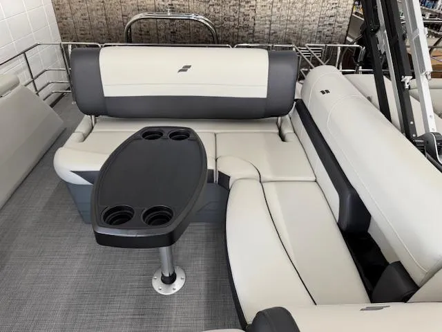 Slide: The Image of 2025 Starcraft EXS 3 Q boat interior with cushioned seating and table. - 13