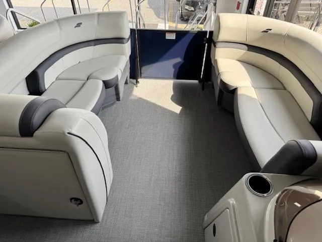 Slide: The Image of Spacious interior of 2025 Starcraft EXS 3 Q pontoon boat with plush seating. - 7