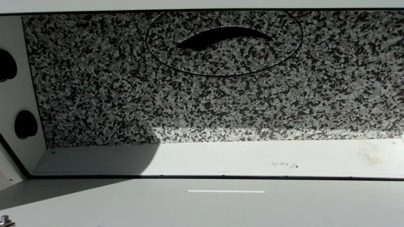 Slide: The Image of Interior view of 2022 Crevalle 33 CSF Offshore Fishing boat storage compartment. - 10