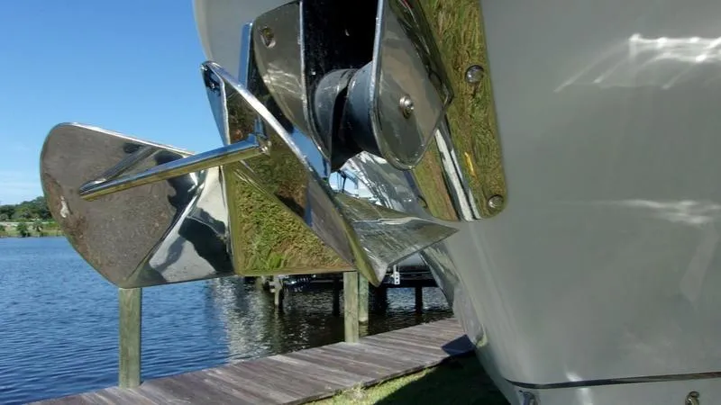 Slide: The Image of Close-up of a 2022 Crevalle 33 CSF Offshore Fishing boat's anchor by the water. - 13