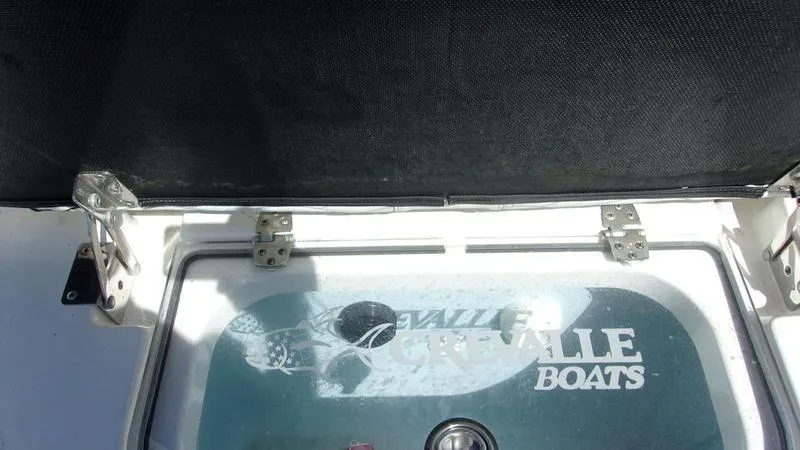 Slide: The Image of Crevalle 33 CSF Offshore Fishing boat hatch with logo, 2022 model. - 22