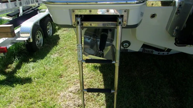 Slide: The Image of 2022 Crevalle 33 CSF Offshore Fishing boat ladder on grass. - 24