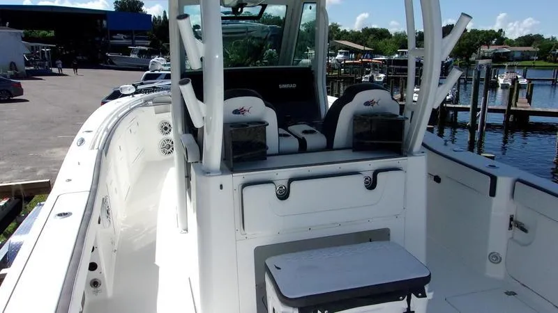 Slide: The Image of 2022 Crevalle 33 CSF Offshore Fishing boat, spacious deck, modern design, docked at marina. - 32