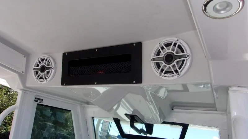 Slide: The Image of 2022 Crevalle 33 CSF Offshore Fishing boat interior with speakers and ventilation. - 4