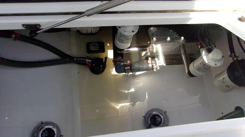 Slide: The Image of Crevalle 33 CSF Offshore Fishing 2022 boat interior with visible plumbing and filters. - 5