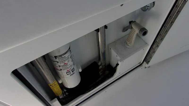 Slide: The Image of 2022 Crevalle 33 CSF Offshore Fishing boat interior compartment with equipment and wiring. - 9