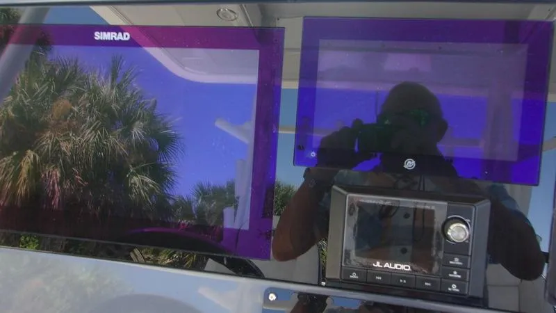 Slide: The Image of Simrad and JL Audio displays on 2022 Crevalle 33 CSF Offshore Fishing boat. - 3