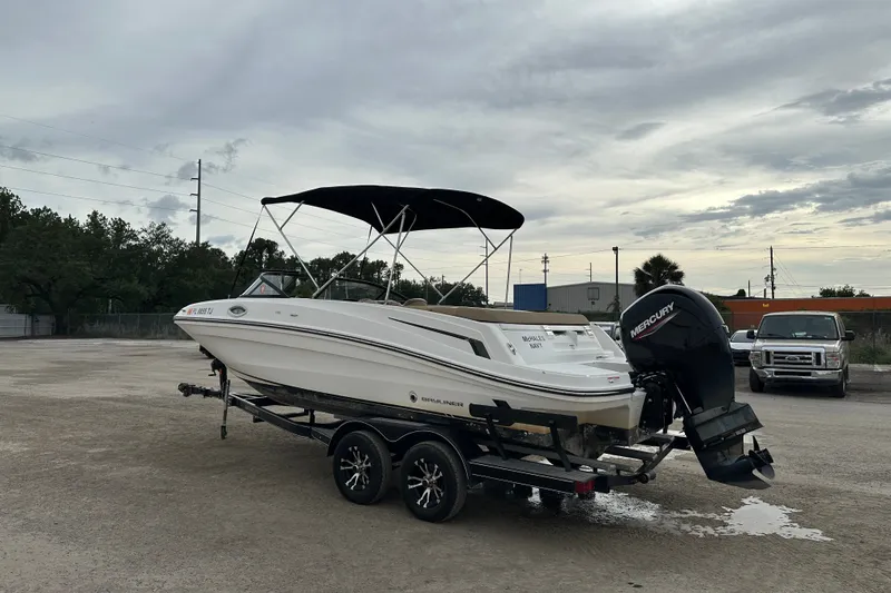 Slide: The Image of 2023 Bayliner VR4 Bowrider OB on trailer with Mercury outboard motor. - 2