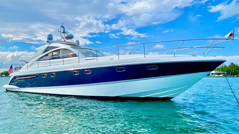 Slide: The Image of 2007 Fairline Targa 52 yacht on clear blue water under a bright sky. - 1