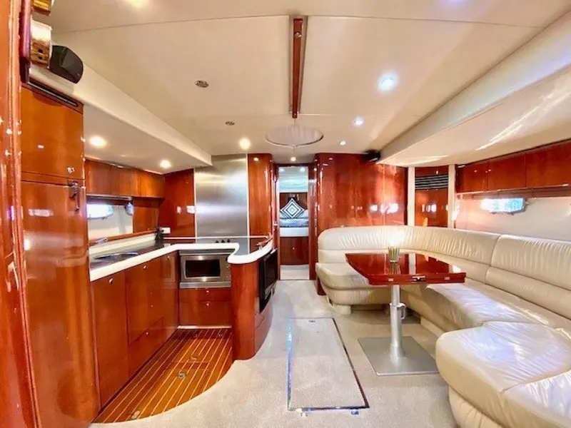 Slide: The Image of Luxurious 2007 Fairline Targa 52 yacht interior with elegant wood finishes and plush seating. - 10