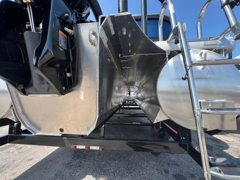 Slide: The Image of 2025 Premier 220 Sunscape boat underside with ladder and engine components. - 10