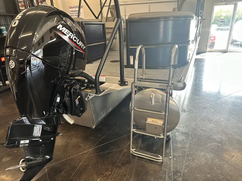 Slide: The Image of 2025 Premier 220 Sunscape pontoon boat with Mercury outboard motor and ladder. - 19