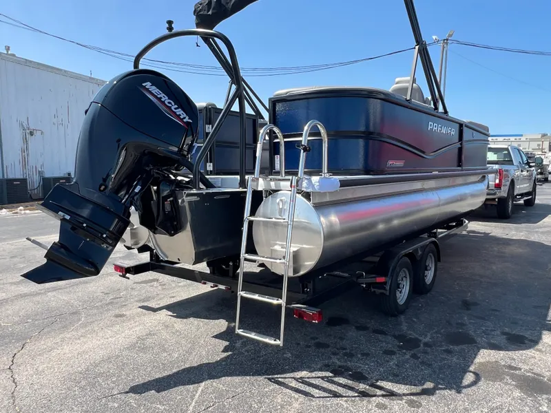 Slide: The Image of 2025 Premier 220 Sunscape pontoon boat with Mercury outboard motor on trailer. - 3