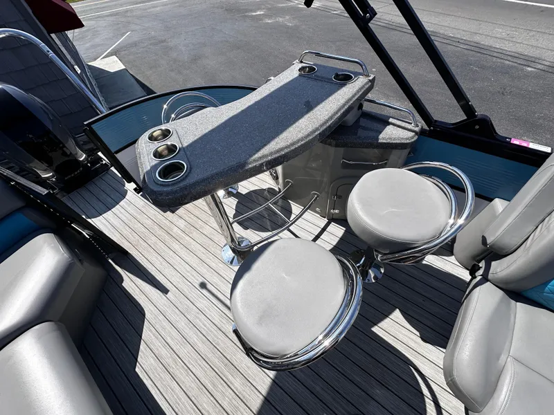 Slide: The Image of 2020 Misty Harbor 2585 Biscayne Bay CE boat interior with seating and table setup. - 10