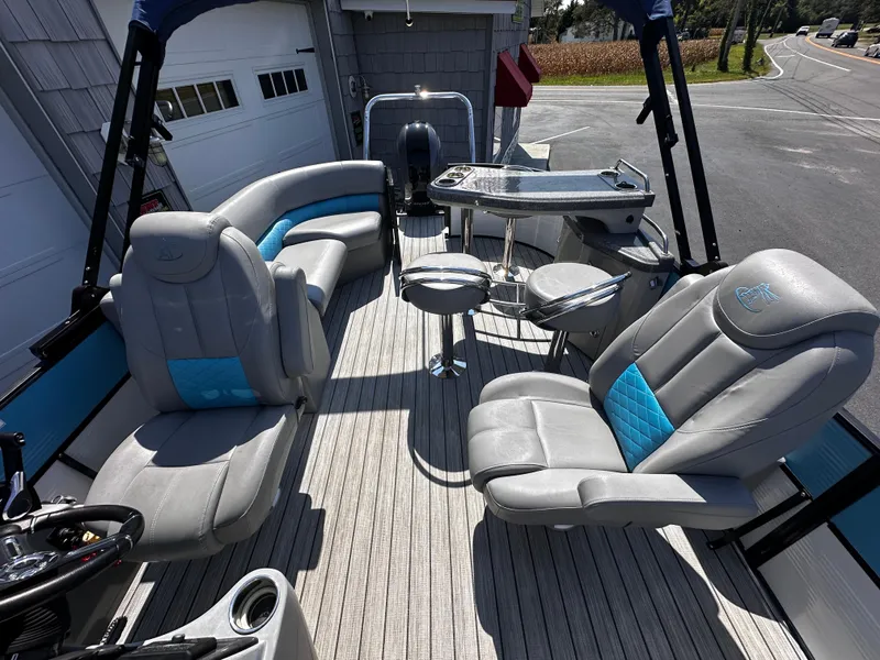 Slide: The Image of 2020 Misty Harbor 2585 Biscayne Bay CE pontoon boat interior with plush seating and table. - 11