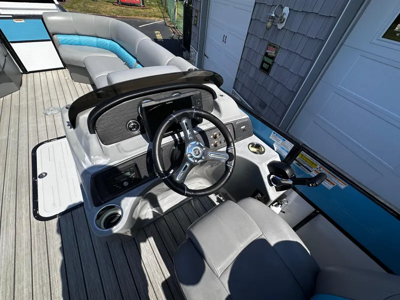 Slide: The Image of 2020 Misty Harbor 2585 Biscayne Bay CE boat interior with steering wheel and seating. - 14