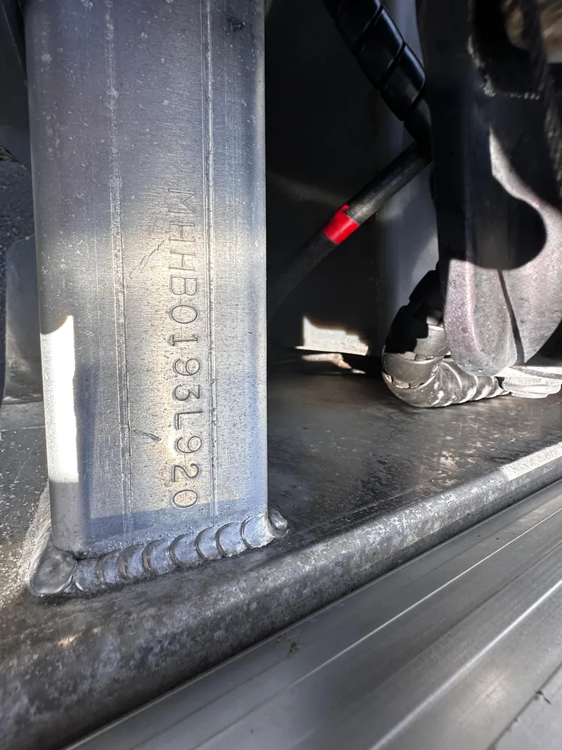 Slide: The Image of Close-up of 2020 Misty Harbor 2585 Biscayne Bay CE boat's serial number and metal components. - 22