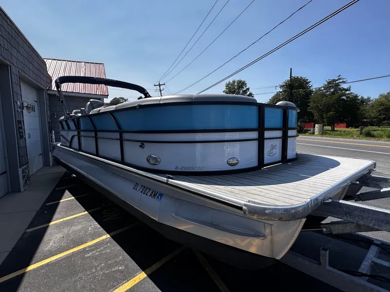 Slide: The Image of 2020 Misty Harbor 2585 Biscayne Bay CE pontoon boat on trailer, parked outdoors. - 6