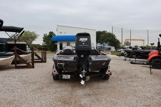 Slide: The Image of 2017 Ranger Z519 boat with 225 HP engine in a gravel lot. - 3