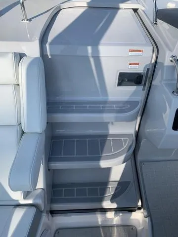 Slide: The Image of 2025 Regal 28 Express boat interior steps with sleek gray design. - 14