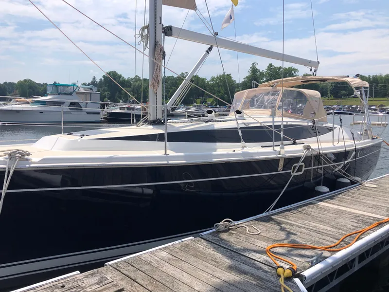 The Image of 2016 Marlow-Hunter 37 sailboat docked at a marina, featuring sleek design and modern rigging. - 0