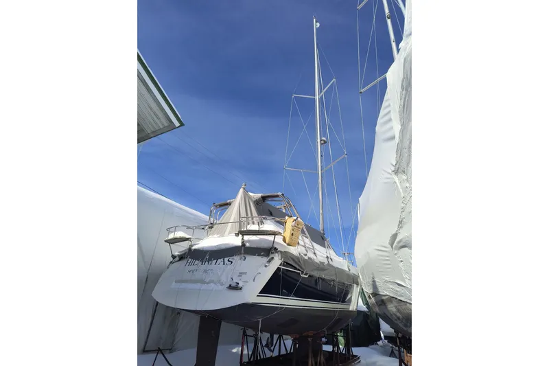 Slide: The Image of 2016 Marlow-Hunter 37 sailboat on stands, covered for winter storage. - 107