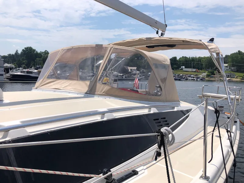 Slide: The Image of 2016 Marlow-Hunter 37 sailboat docked at a marina on a sunny day. - 2