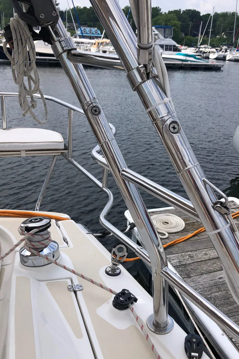 Slide: The Image of 2016 Marlow-Hunter 37 sailboat docked, showcasing stainless steel rigging and deck details. - 24