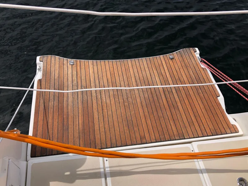 Slide: The Image of Teak deck of 2016 Marlow-Hunter 37 sailboat with ocean backdrop. - 26
