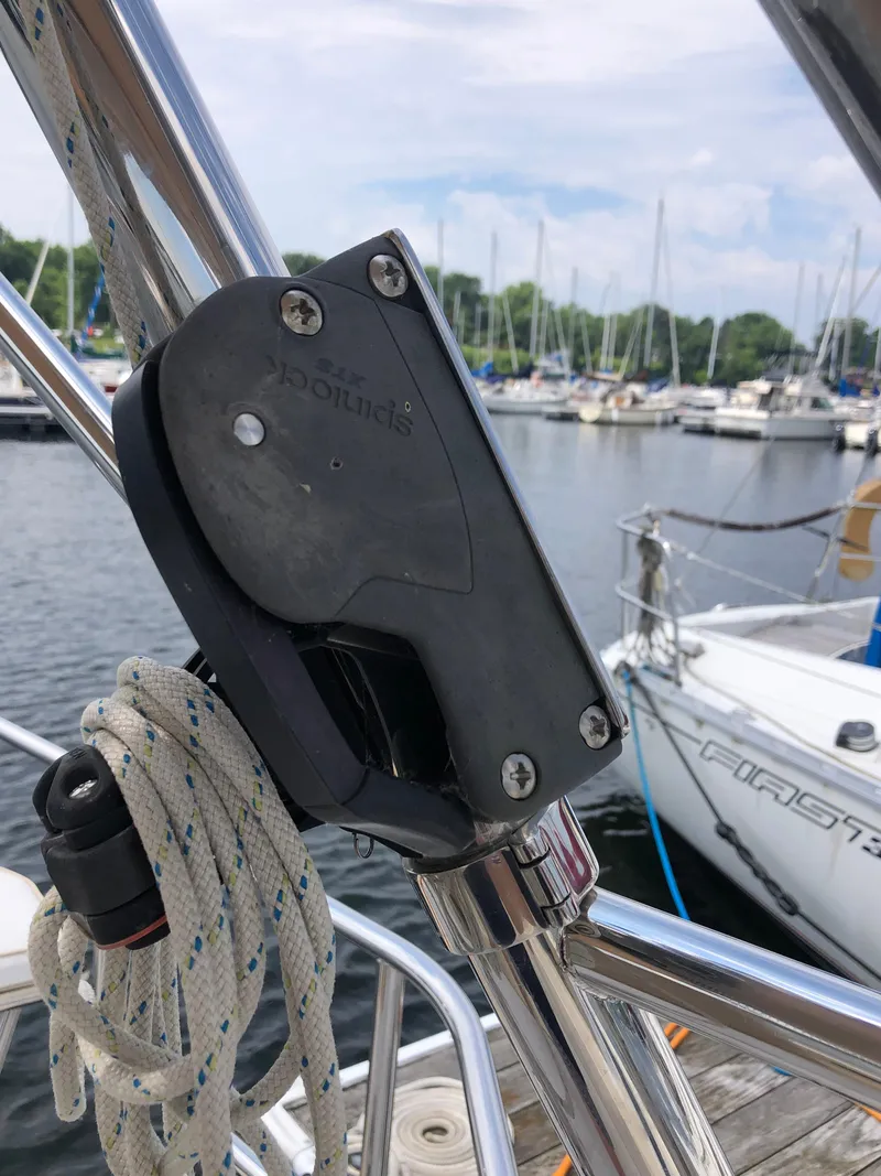 Slide: The Image of Close-up of a 2016 Marlow-Hunter 37 sailboat's rigging hardware at a marina. - 32