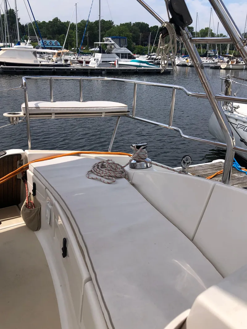 Slide: The Image of 2016 Marlow-Hunter 37 sailboat cockpit with marina view in the background. - 36