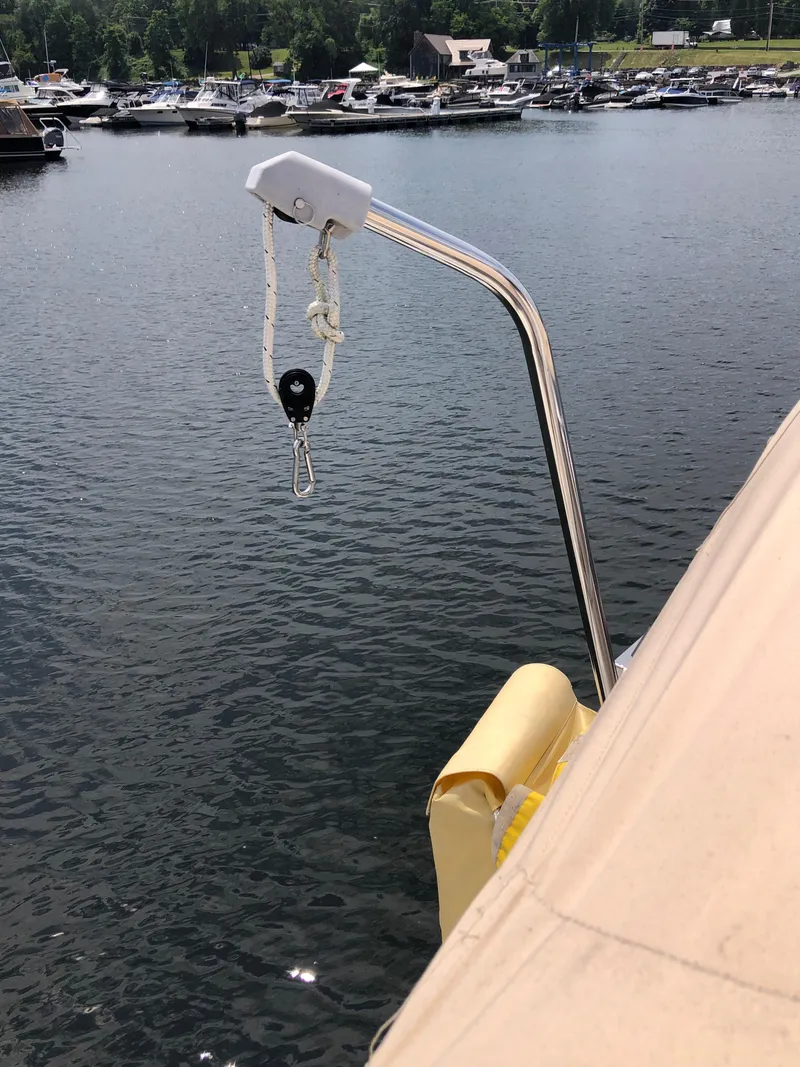 Slide: The Image of Sailboat deck view with davit system, Marlow-Hunter 37, 2016 model, docked at marina. - 39