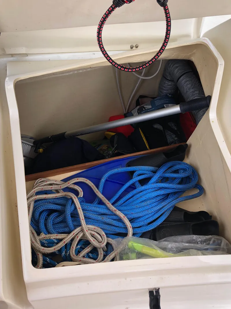 Slide: The Image of Storage compartment of 2016 Marlow-Hunter 37 sailboat with ropes and equipment. - 41
