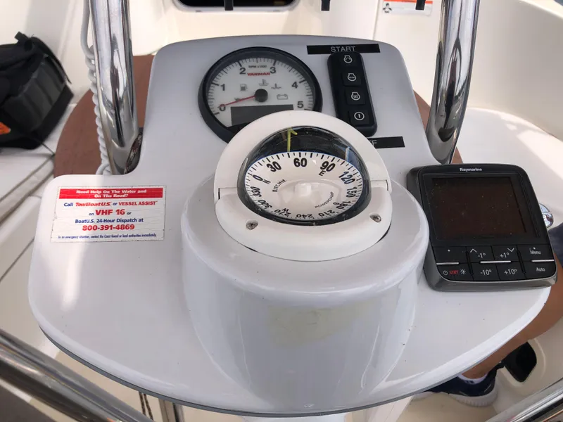 Slide: The Image of Control panel of a 2016 Marlow-Hunter 37 sailboat with compass and navigation instruments. - 46