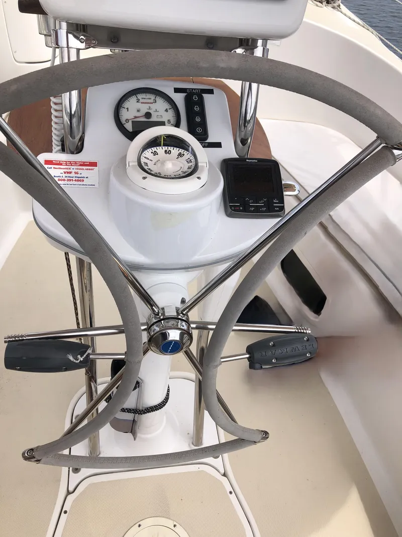 Slide: The Image of Steering wheel and controls of a 2016 Marlow-Hunter 37 sailboat cockpit. - 48