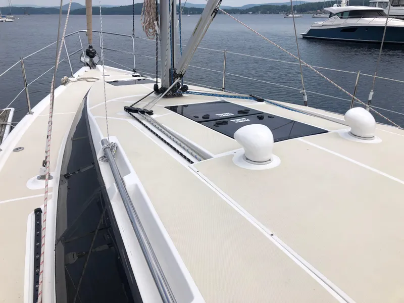 Slide: The Image of Sailboat deck of 2016 Marlow-Hunter 37, moored on calm water. - 6
