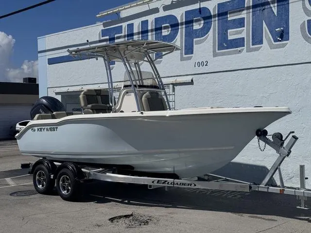 Slide: The Image of 2025 Key West 219 FS boat on trailer, parked outside Tuppen's building. - 10