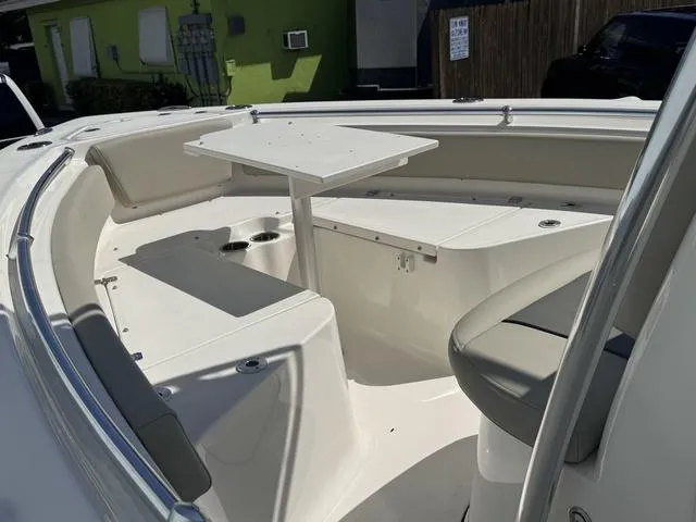 Slide: The Image of 2025 Key West 219 FS boat interior with seating and table. - 9