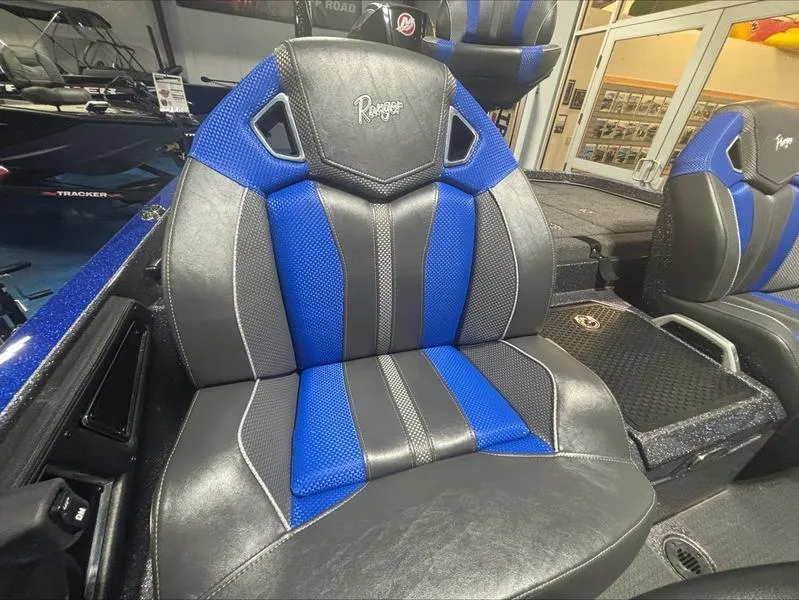 Slide: The Image of 2024 Ranger Z 521 R CUP ED boat seat with blue and black design. - 11