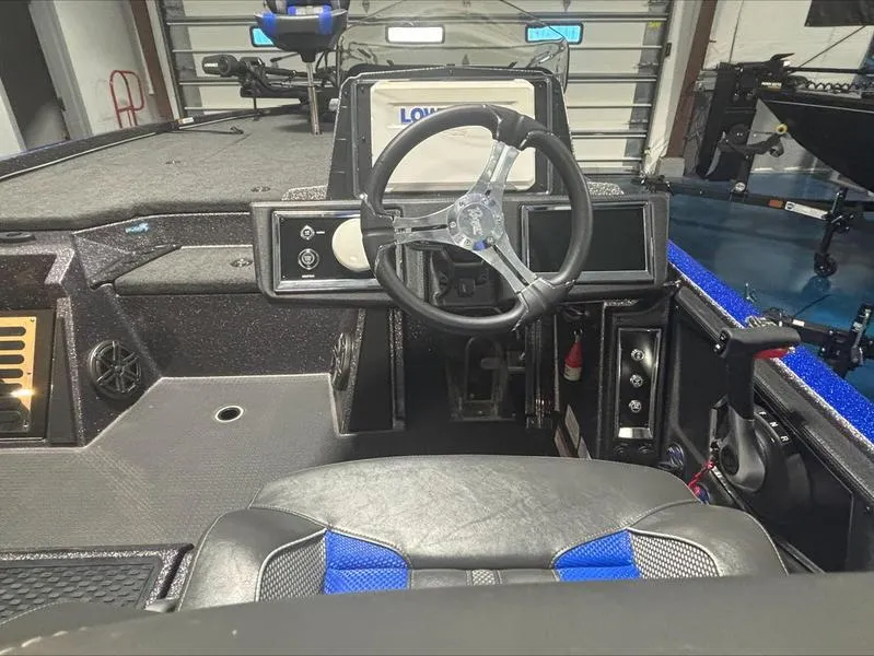 Slide: The Image of 2024 Ranger Z 521 R CUP ED boat interior with steering wheel and dashboard. - 13