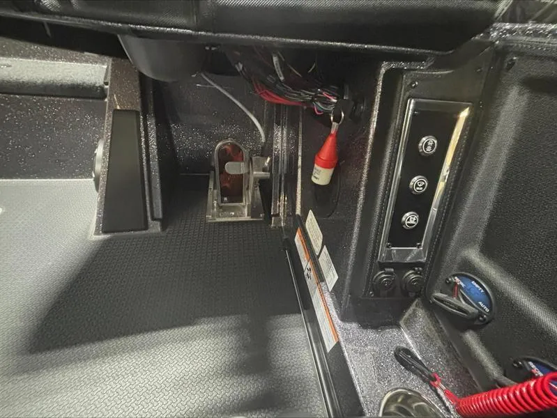 Slide: The Image of Interior view of 2024 Ranger Z 521 R CUP ED boat dashboard controls. - 14