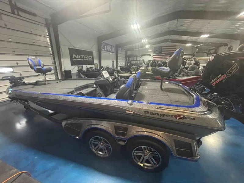 Slide: The Image of 2024 Ranger Z 521 R CUP ED boat in showroom, featuring sleek design and dual seats. - 4